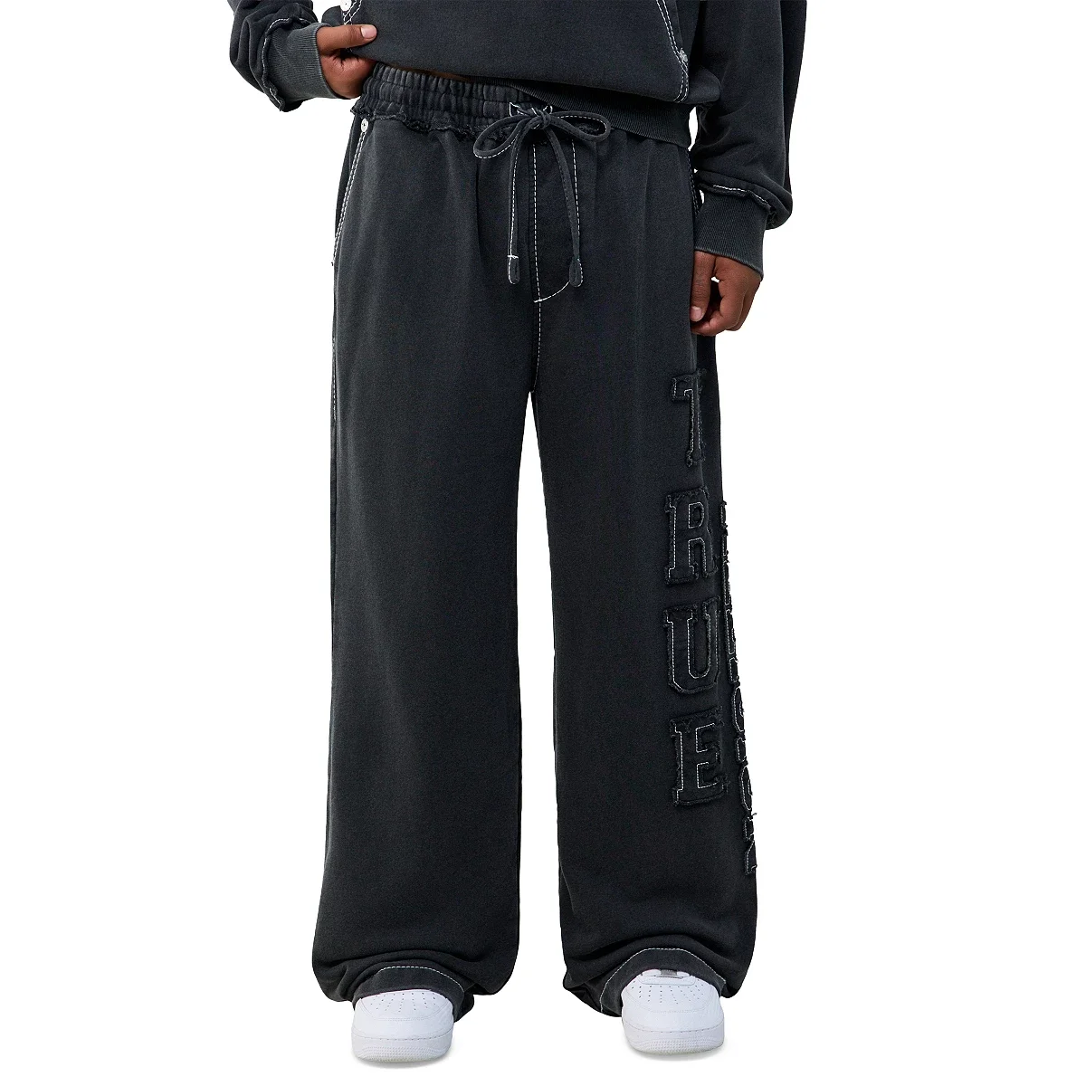 Pantalones deportivos Baggy Big T con logotipo y aplique