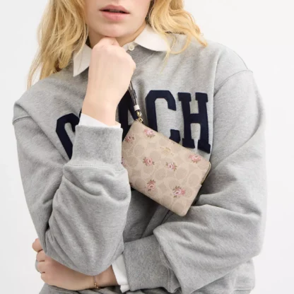 Bolso de mano con cremallera en las esquinas, de lona distintiva y estampado floral - Imagen 2