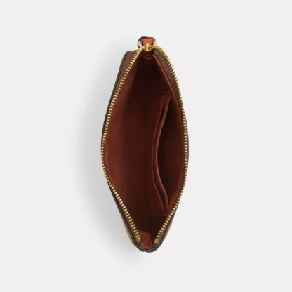 Bolso de mano con cremallera en las esquinas, de lona distintiva y estampado naranja - Imagen 3