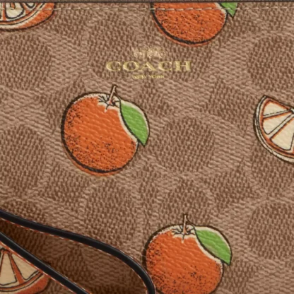 Bolso de mano con cremallera en las esquinas, de lona distintiva y estampado naranja - Imagen 4